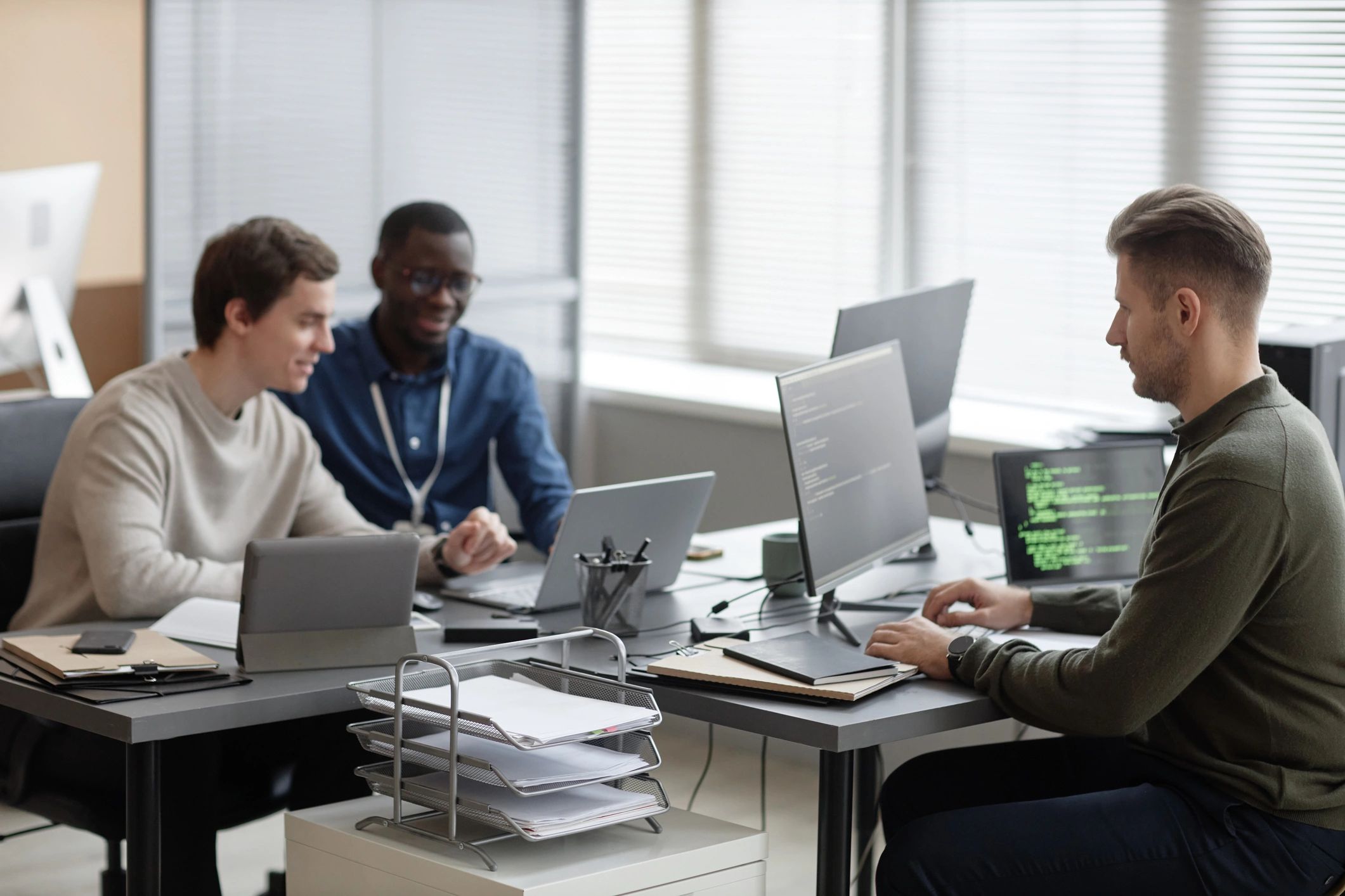 Team members working together in an office on secure systems